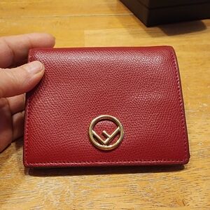 Fendi 'F is Fendi' compact wallet in burgundy grained leather.